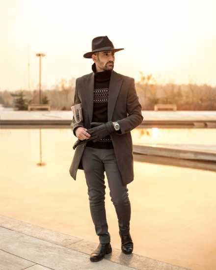 a man wearing a brown suit jacket