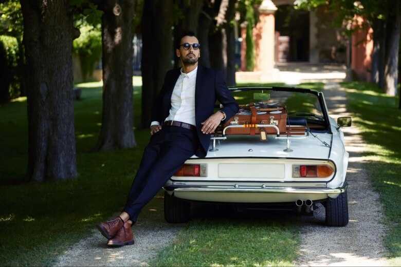 Business Man Leaning on Luxury Car