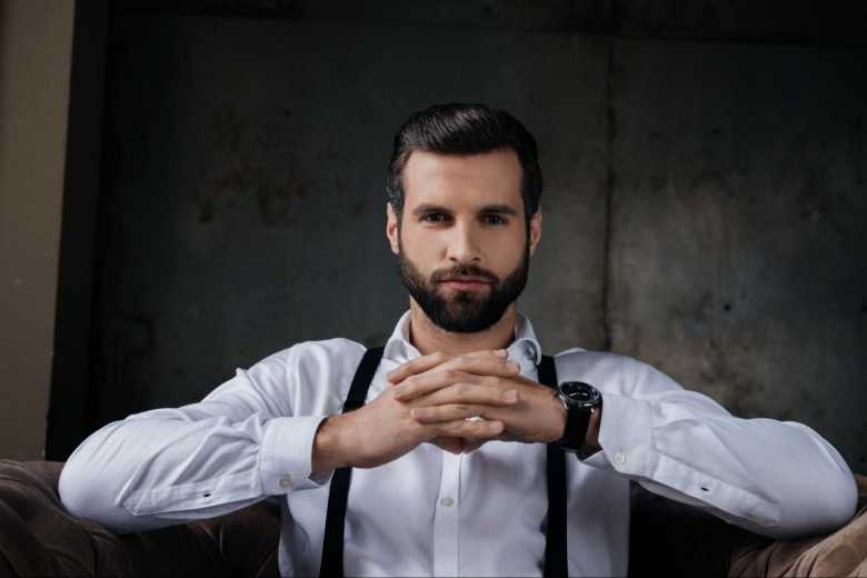 Dark Haired Man Facing the Camera Wearing Suspenders