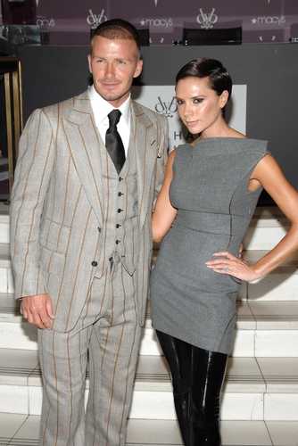 David Beckham wearing a Tom Ford suit, together with his wife Victoria Beckham