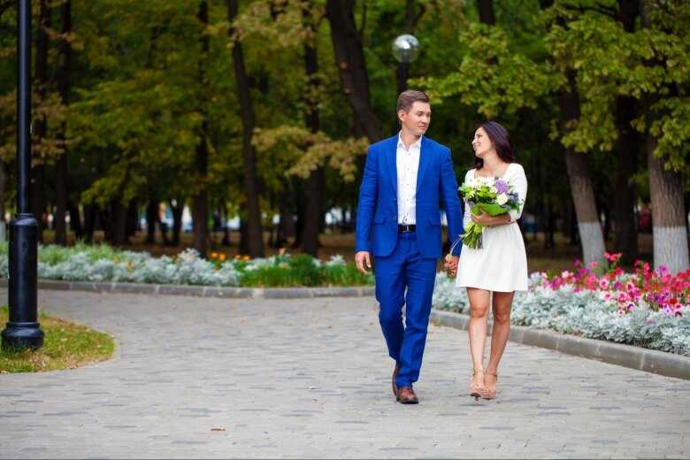 Happy Couple Walking, Man Wearing a Royal Blue Suit