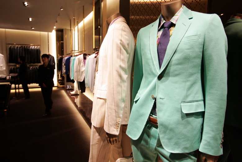 mannequins wearing Gucci suits