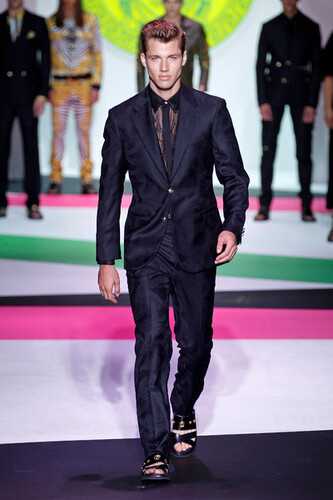 a model wearing Versace on the runway