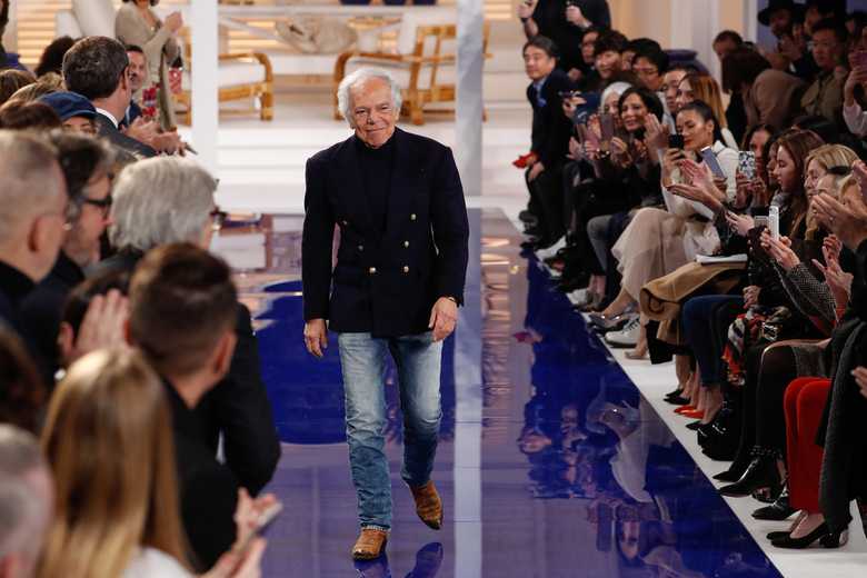 Ralph Lauren wearing a signature RL jacket on the runway