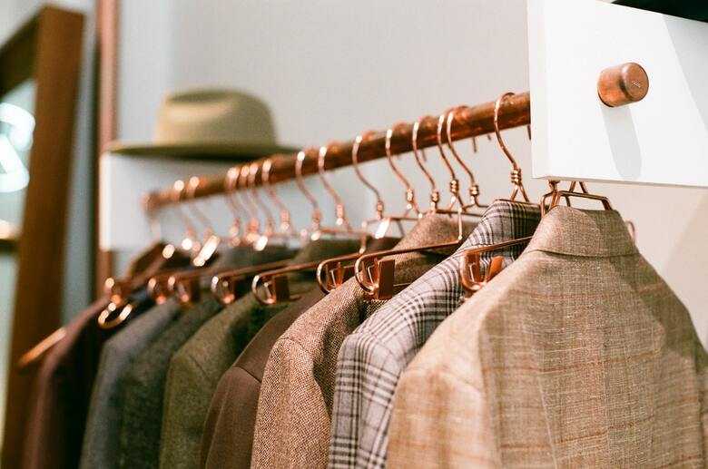 various types of suits hanging on a suit hanger