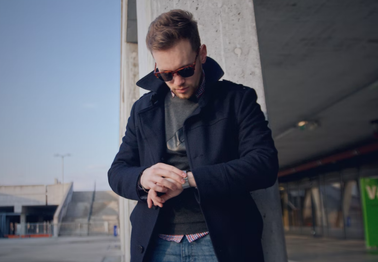 A man wearing a dark blue peacoat